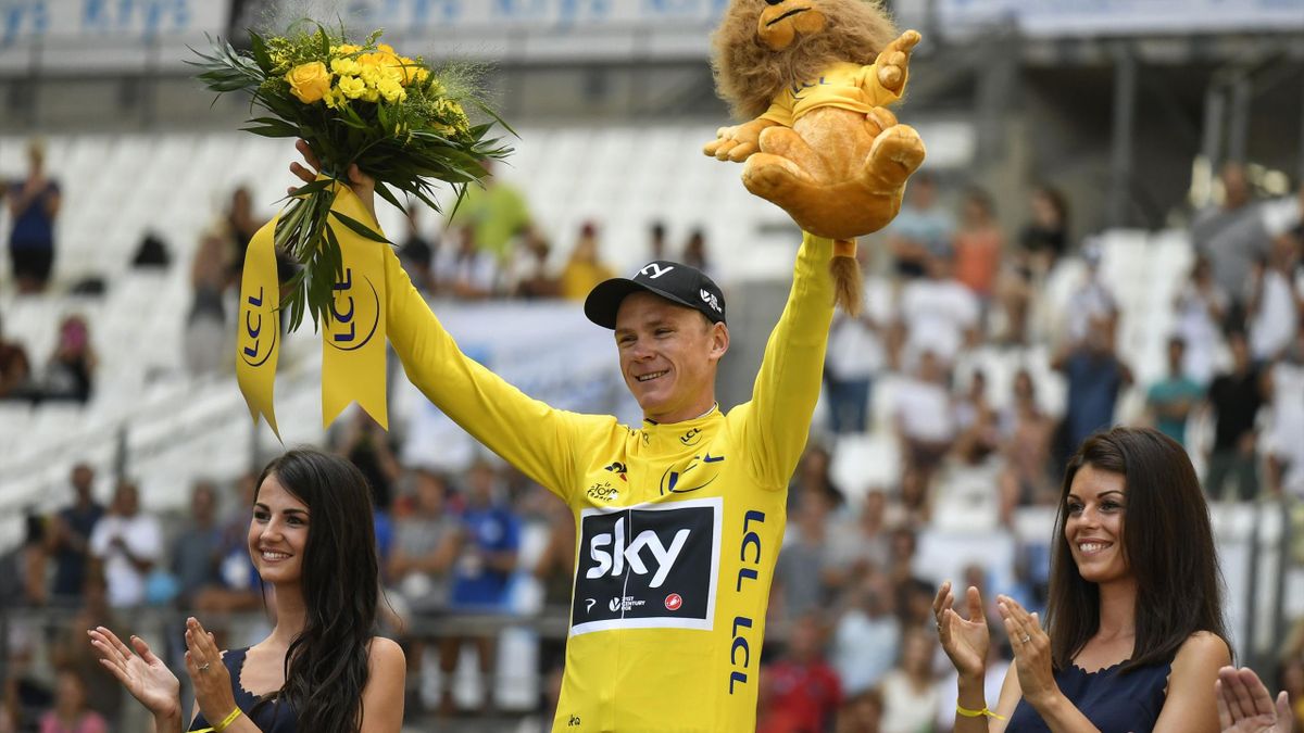 Chris Froome wears the yellow jersey at the Stade Velodrome in Marseille