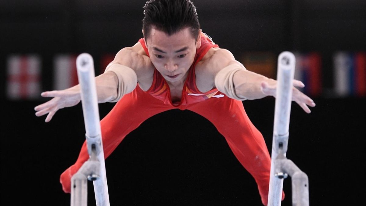 China's Jingyuan Zou competes in the artistic gymnastics men's parallel bars final of the Tokyo 2020 Olympic Games at Ariake Gymnastics Centre in Tokyo on August 3, 2021.