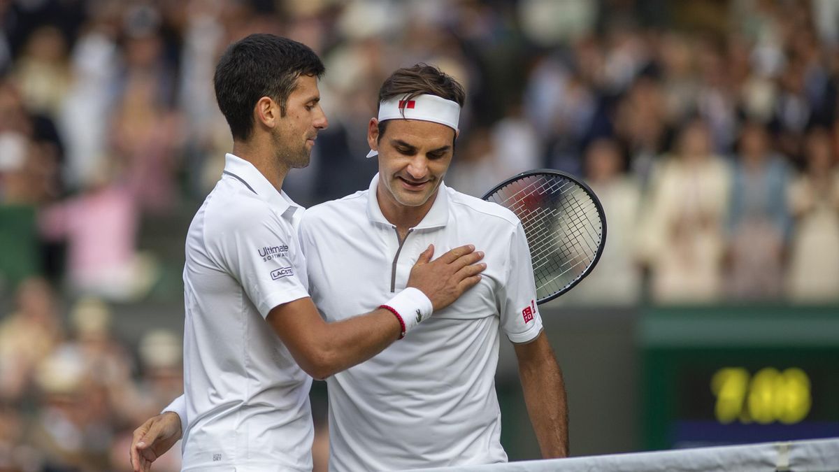 Roger Federer of Switzerland congratulates Novak Djokovic of Serbia at the net after his victory during the Men's Singles Final on Centre Court during the Wimbledon Lawn Tennis Championships