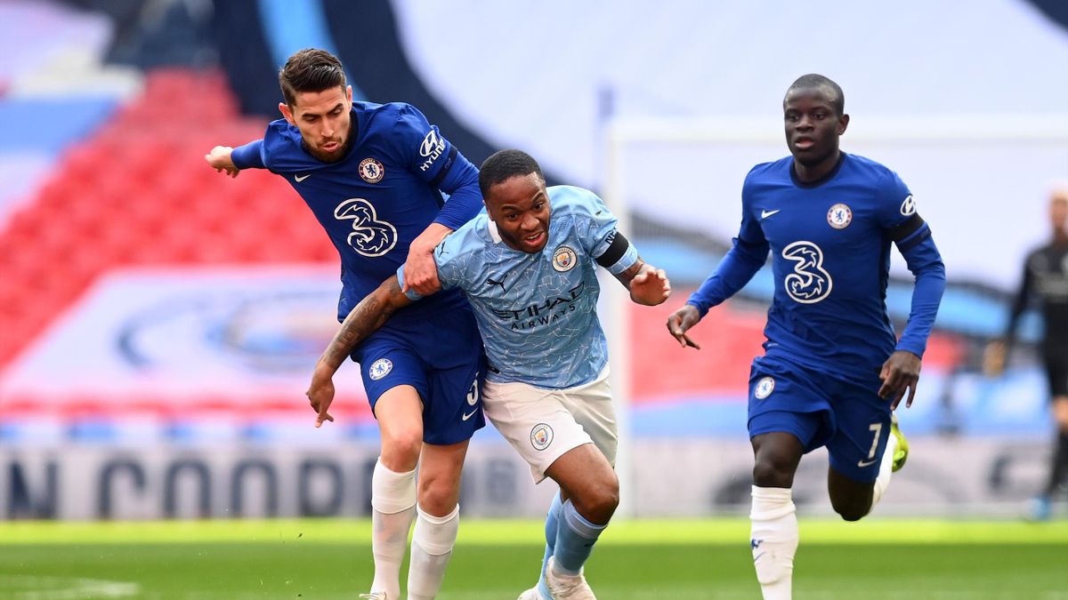 Raheem Sterling of Manchester City is challenged by Jorginho of Chelsea during the Semi Final of the Emirates FA Cup match between Manchester City and Chelsea FC at Wembley Stadium on April 17, 2021 in London, England.