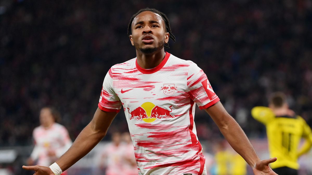Christopher Nkunku of RB Leipzig celebrates after scoring their team's first goal during the Bundesliga match between RB Leipzig and Borussia Dortmund at Red Bull Arena