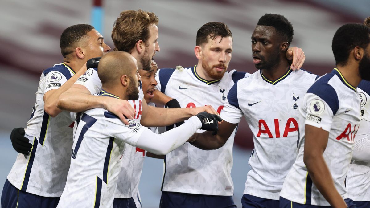 Harry Kane of Tottenham Hotspur celebrates with team mates after scoring a goal to make it 0-2 during the Premier League match between Aston Villa and Tottenham Hotspur at Villa Park on March 21, 2021 in Birmingham