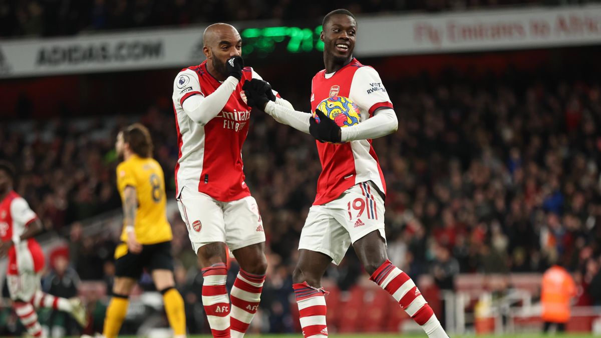 LONDON, ENGLAND - FEBRUARY 24: Nicolas Pepe of Arsenal celebrates after scoring a goal to make it 1-1 during the Premier League match between Arsenal and Wolverhampton Wanderers at Emirates Stadium on February 24, 2022 in London, England. (Photo by Matthe
