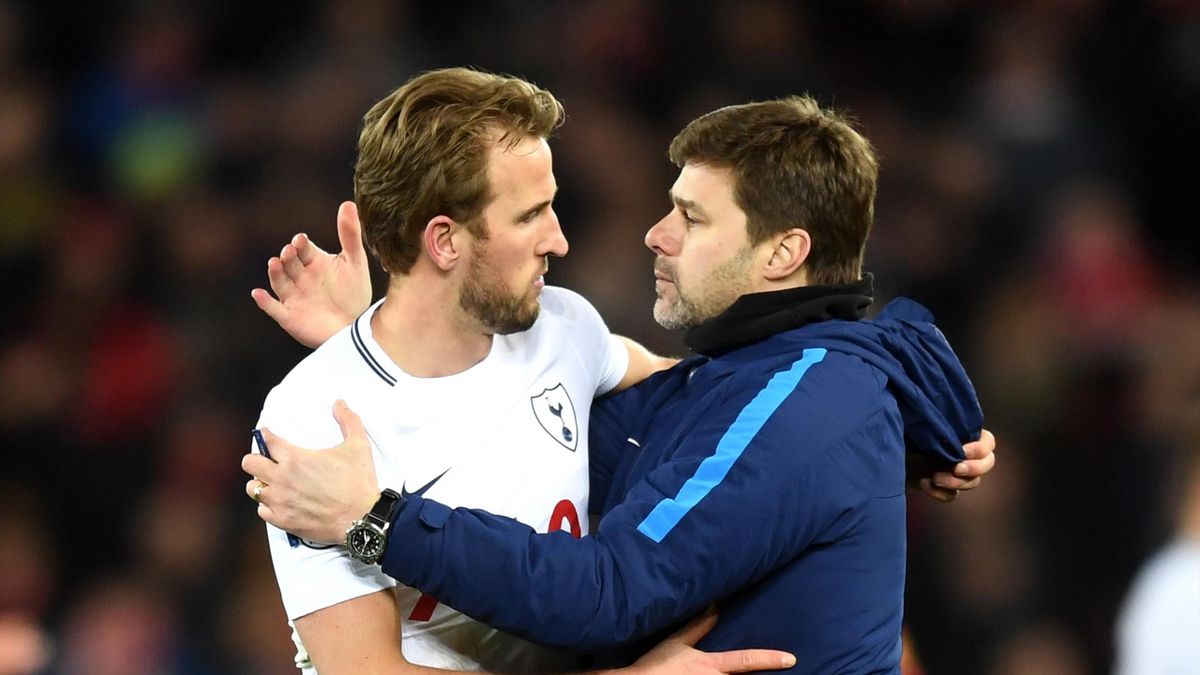 Harry Kane of Tottenham Hotspur and Mauricio Pochettino, Manager of Tottenham Hotspur celebrate vicotry after the Premier League match between Liverpool and Tottenham Hotspur at Anfield on February 4, 2018 in Liverpool, England