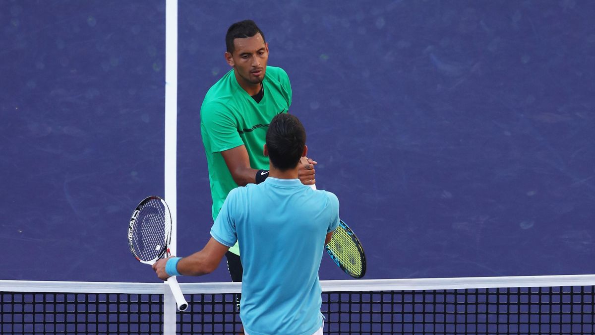 Nick Kyrgios of Australia shakes hands at the net after his straight set victory against Novak Djokovic of Serbia