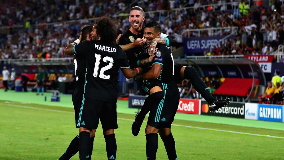 Casemiro of Real Madrid (right) celebrates with teammates Sergio Ramos and Marcelo after opening the scoring during the UEFA Super Cup match between Real Madrid and Manchester United at National Arena Filip II Macedonian on August 8, 2017 in Skopje, Maced