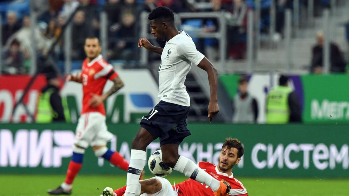 France's forward Ousmane Dembele and Russia's midfielder Aleksandr Erokhin vie for the ball during an international friendly football match between Russia and France at the Saint Petersburg Stadium in Saint Petersburg on March 27, 2018.