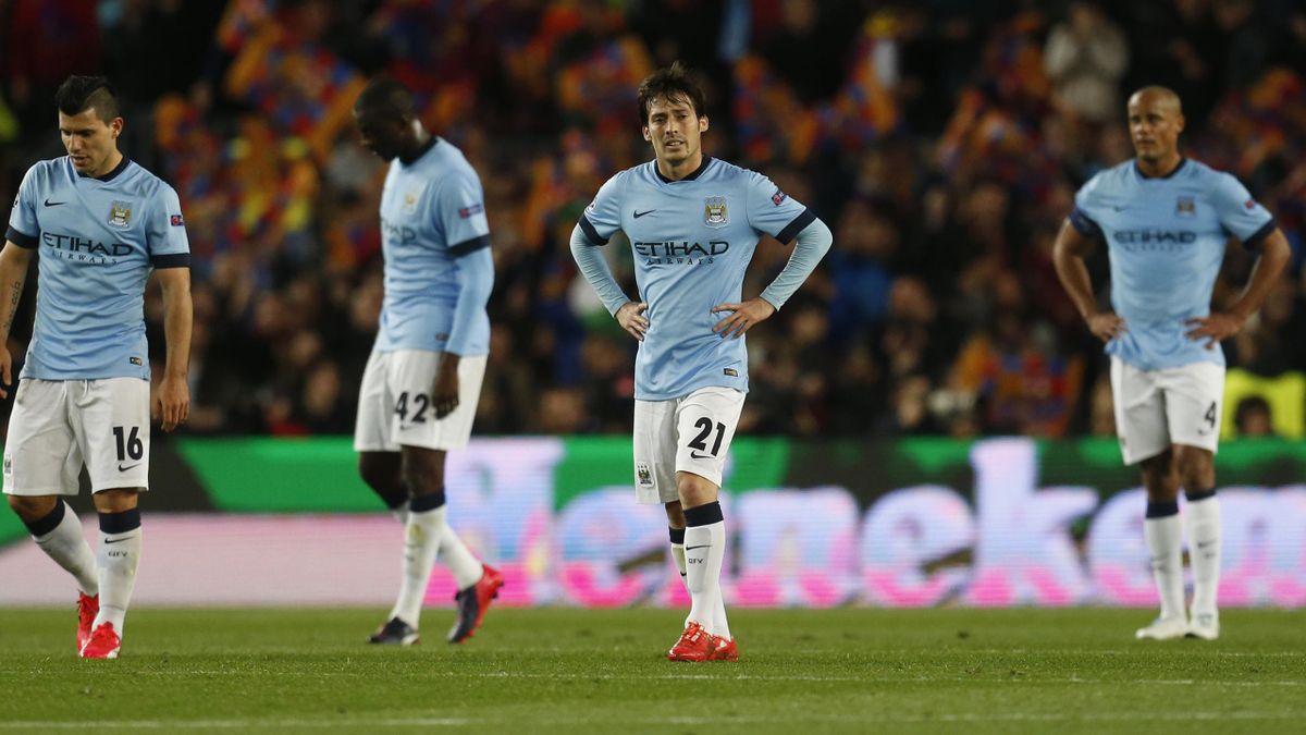 Manchester City's Sergio Aguero (L), Yaya Toure, David Silva and Vincent Kompany (R) look dejected after Barcelona's first goal (Reuters)