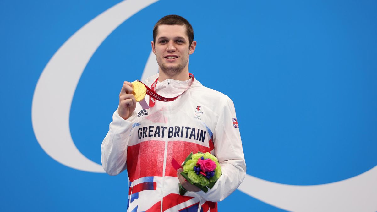 Reece Dunn of Team Great Britain celebrates with the gold medal during the medal ceremony for the Men’s 200m Individual Medley - SM14 Final