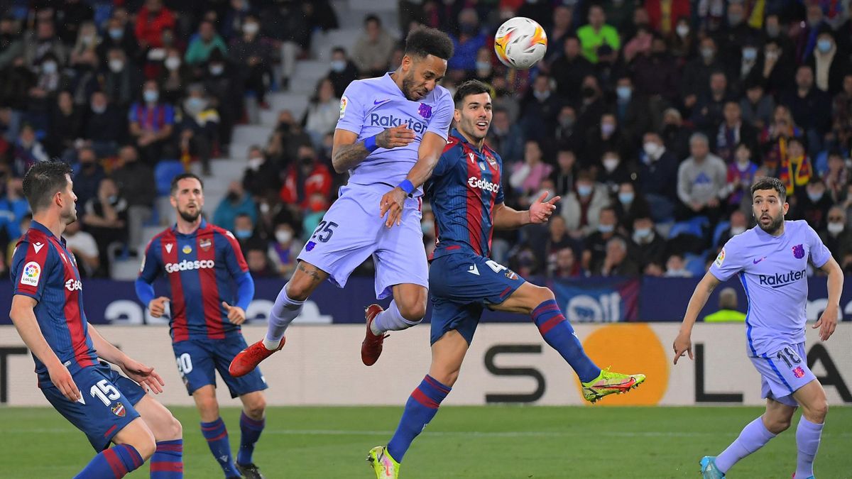Barcelona's Gabonese midfielder Pierre-Emerick Aubameyang heads the ball and scores his team's first goal during the Spanish league football match between Levante UD and FC Barcelona at the Ciutat de Valencia stadium in Valencia on April 10, 2022.