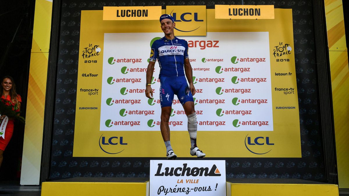 Belgium's Philippe Gilbert, injured after a serious fall, steps on the podium to receive a prize for being the stage's most aggressive rider, following the 16th stage of the 105th edition of the Tour de France
