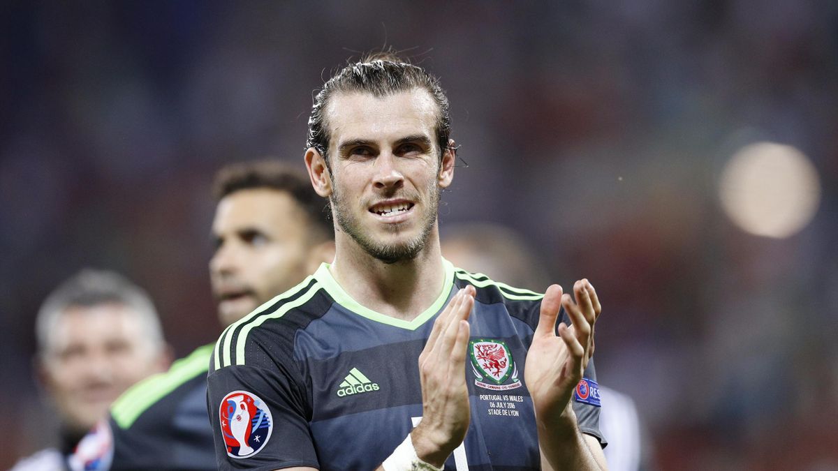 Wales' Gareth Bale reacts as he appluds fans after the game