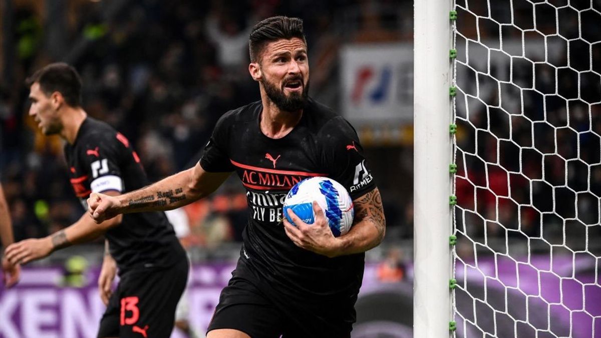 AC Milan's French forward Olivier Giroud celebrates after scoring during the Italian Serie A football match between AC Milan and Hellas Verona on October 16, 2021