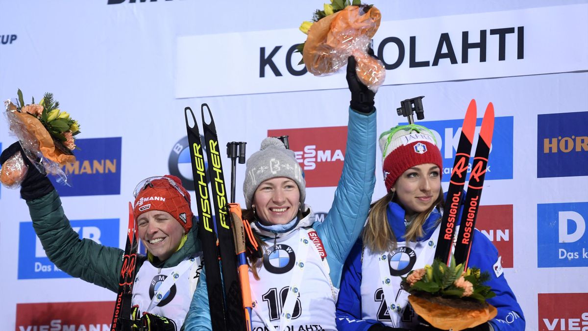 Second placed Franziska Hildebrand of Germany, winner Darya Domracheva of Belarus and third Lisa Vittozzi of Italy celebrate on the podium after the ladies 7,5km sprint event at the IBU Biathlon World Cup in Kontiolahti, Finland on March 9, 2018.