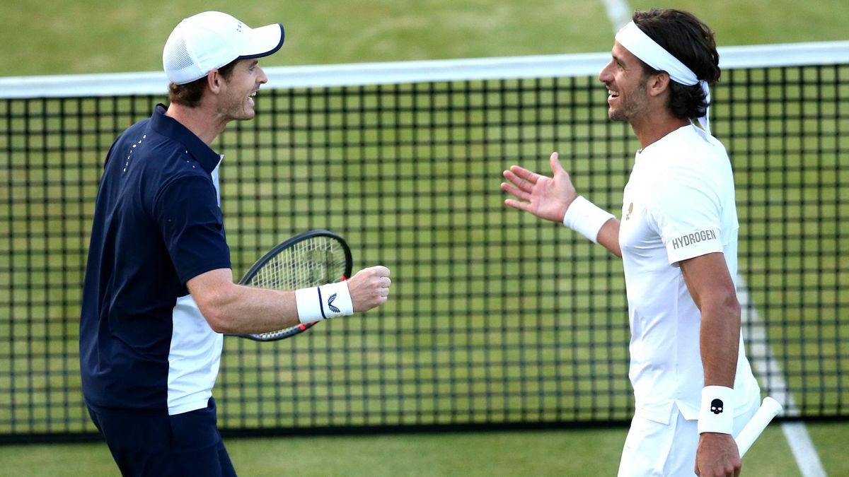 Andy Murray of Great Britain and partner Feliciano Lopez of Spain celebrate match point during the mens doubles semi-final match against Henri Kontinen of Finland John Peers of Australia during day six of the Fever-Tree Championships at Queens Club on Jun