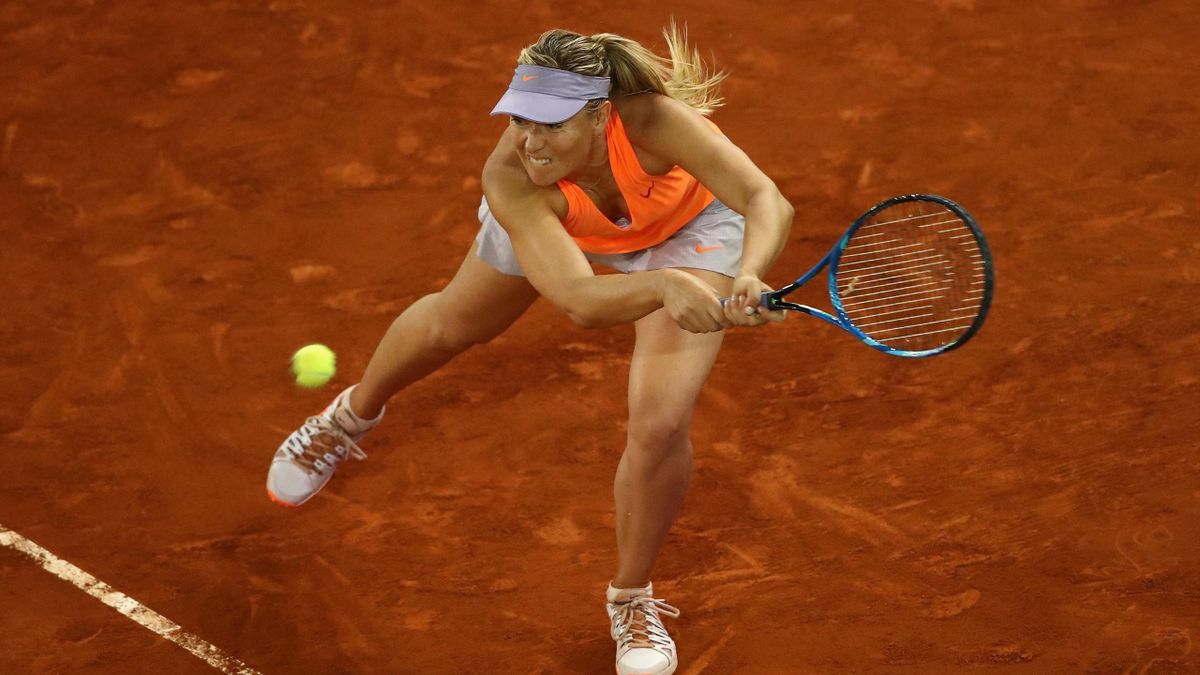 Maria Sharapova of Russia plays a backhand in her match against Eugenie Bouchard of Canada