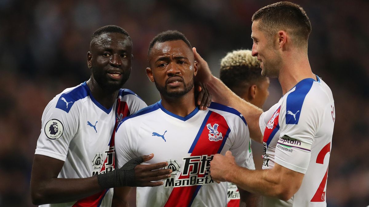 Jordan Ayew of Crystal Palace celebrate with Gary Cahill after scoring goal during the Premier League match between West Ham United and Crystal Palace at London Stadium on October 5, 2019 in London, United Kingdom.