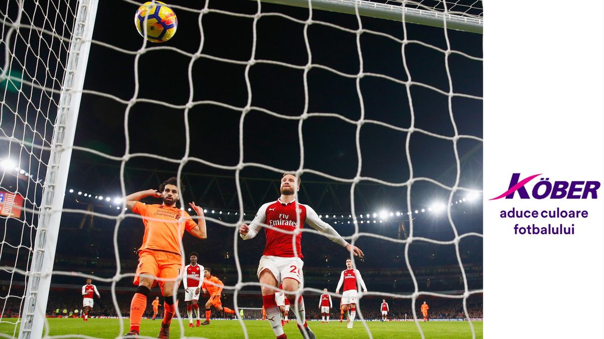 Mohamed Salah of Liverpool and Shkodran Mustafi and Petr Cech of Arsenal watch the ball bounce into the net as Roberto Firmino of Liverpool scores their third goal during the Premier League match between Arsenal and Liverpool at Emirates Stadium on Decemb