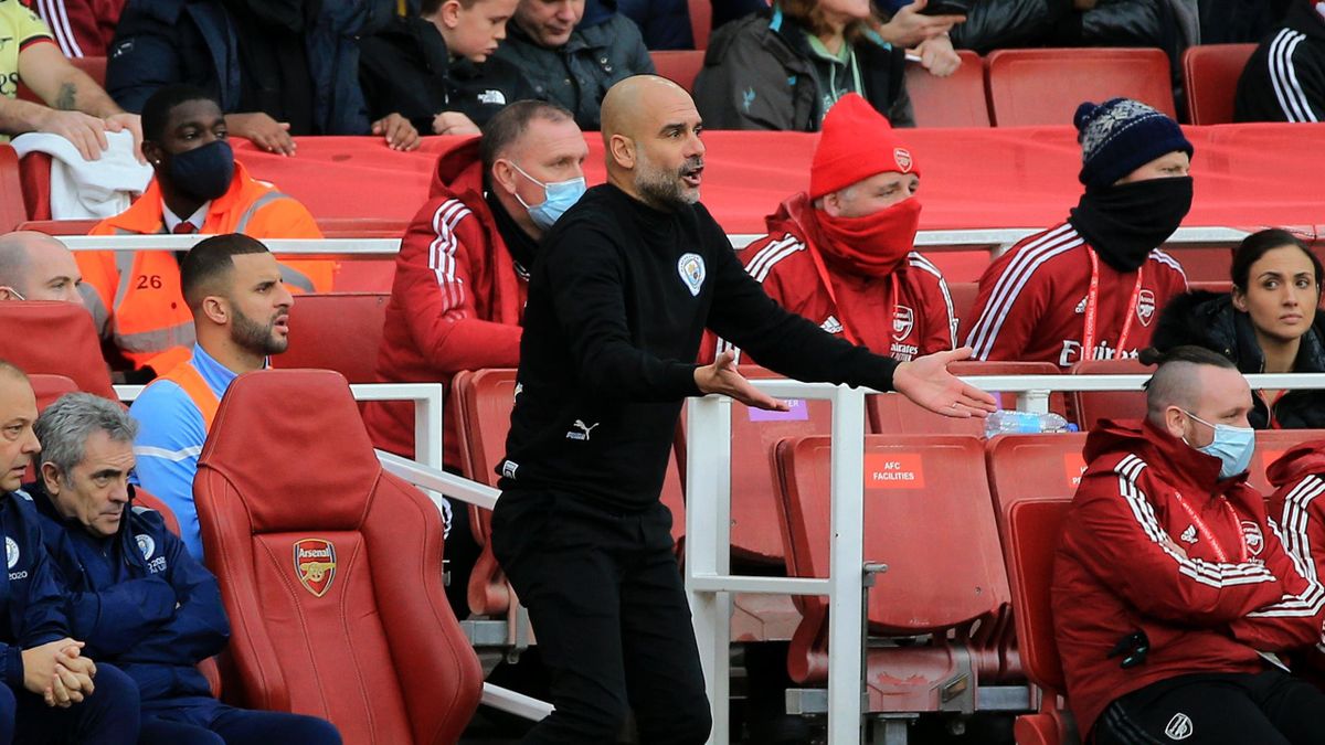 Pep Guardiola, Manager of Manchester City reacts during the Premier League match between Arsenal and Manchester City at Emirates Stadium on January 01, 2022 in London, England. (Photo by Tom Flathers/Manchester City FC via Getty Images)