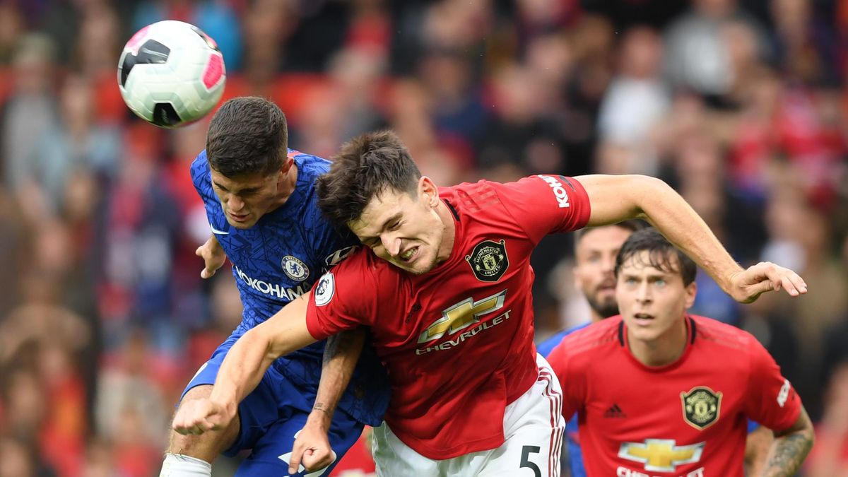 Maguire rises to win the ball from Christian Pulisic