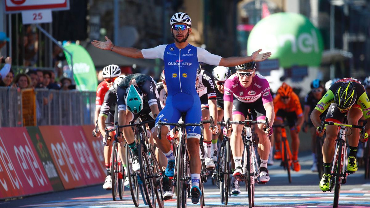 Colombia's Fernando Gaviria of team Quick-Step celebrates as he crosses the finish line of the 5th stage of the 100th Giro d'Italia, Tour of Italy, cycling race from Pedara to Messina on May 10, 2017 in Sicily