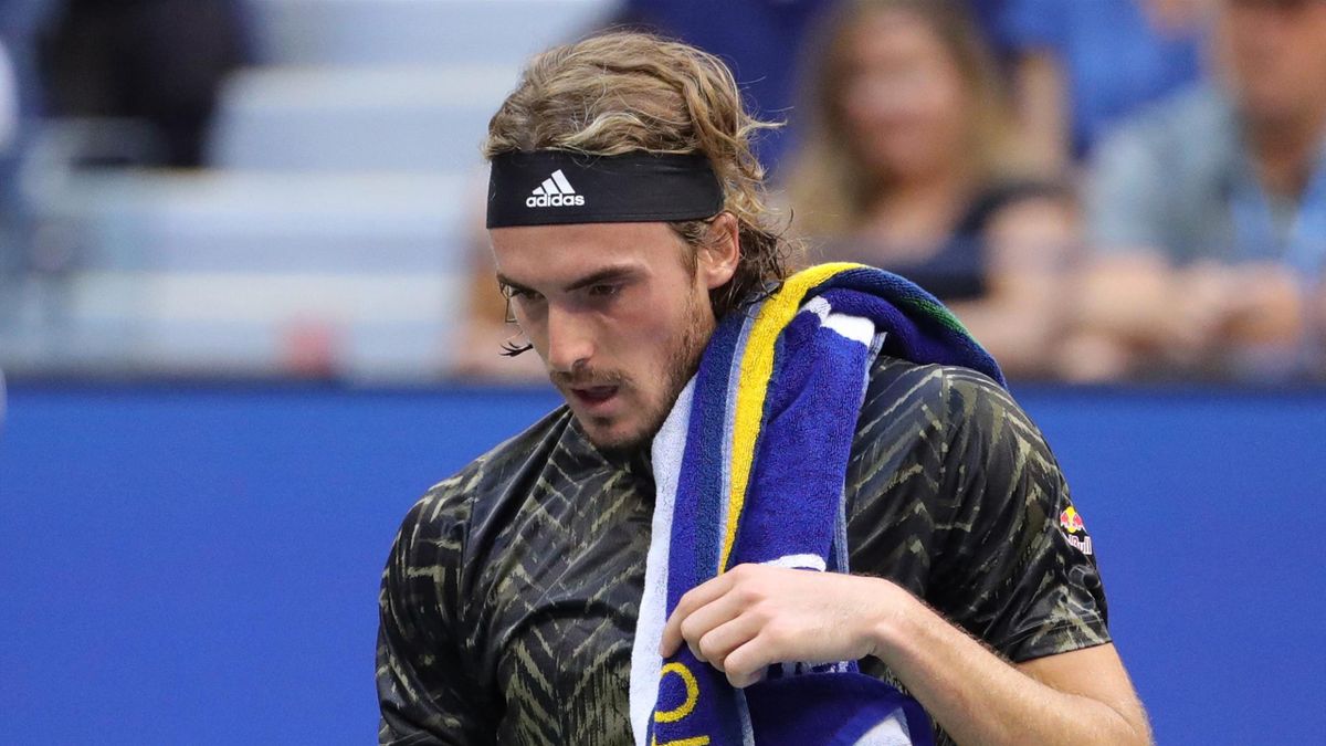 Greece's Stefanos Tsitsipas walks to the other side of the court during his 2021 US Open Tennis tournament men's singles third round match against Spain's Carlos Alcaraz at the USTA Billie Jean King National Tennis Center in New York