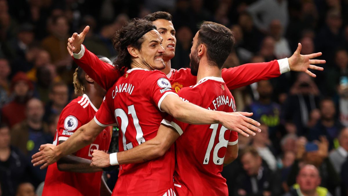Cristiano Ronaldo of Manchester United celebrates scoring his sides first goal with Edinson Cavani and Bruno Fernandes during the Premier League match between Tottenham Hotspur and Manchester United at Tottenham Hotspur Stadium on October 30, 2021 in Lond