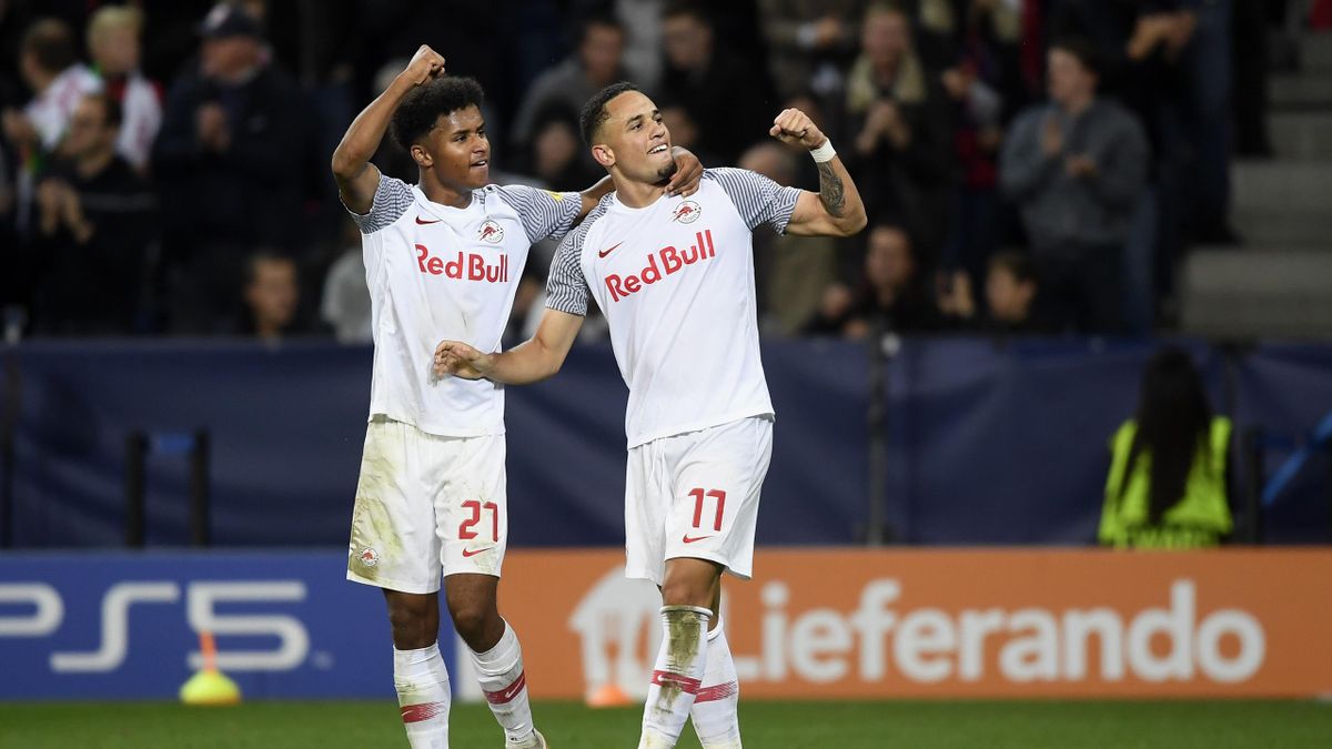Noah Okafor (R) of FC Salzburg celebrates the 2-1 goal with teammate Karim Adeyemi during the UEFA Champions League group G match between FC Salzburg and VfL Wolfsburg at Red Bull Arena