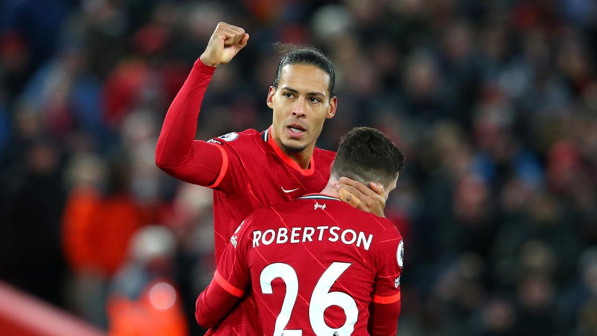 LIVERPOOL, ENGLAND - NOVEMBER 27: Virgil van Dijk of Liverpool celebrates with teammate Andrew Robertson after scoring their side's fourth goal during the Premier League match between Liverpool and Southampton at Anfield on November 27, 2021 in Liverpool,