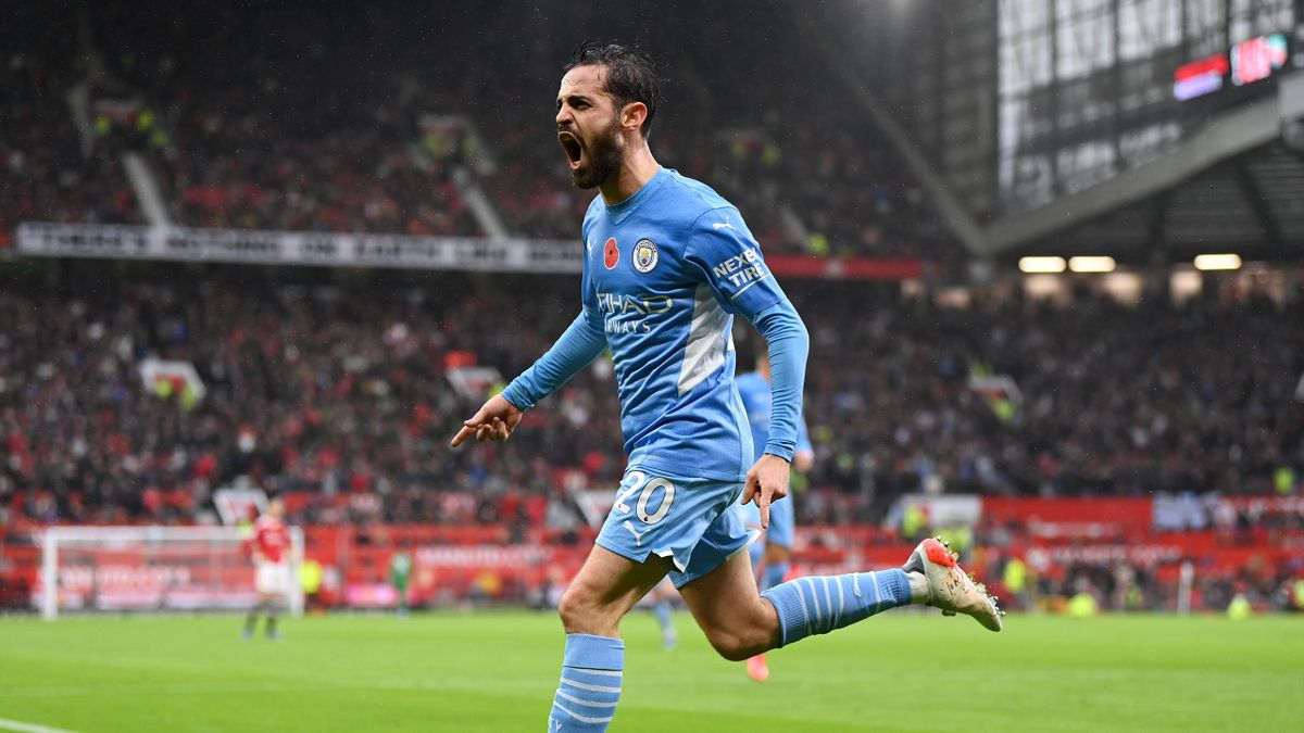 Bernardo Silva of Manchester City celebrates after scoring their side's second goal during the Premier League match between Manchester United and Manchester City at Old Trafford