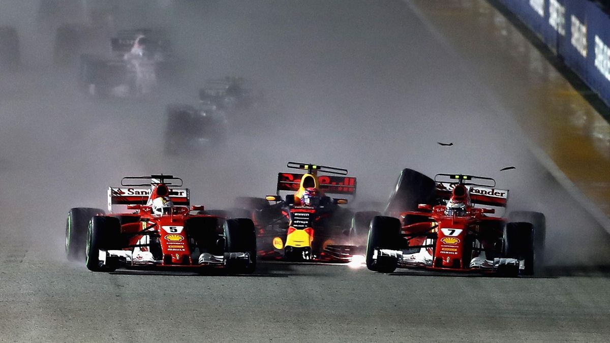 Sebastian Vettel of Germany driving the (5) Scuderia Ferrari SF70H, Max Verstappen of the Netherlands driving the (33) Red Bull Racing Red Bull-TAG Heuer RB13 TAG Heuer and Kimi Raikkonen of Finland driving the (7) Scuderia Ferrari SF70H are caught up in