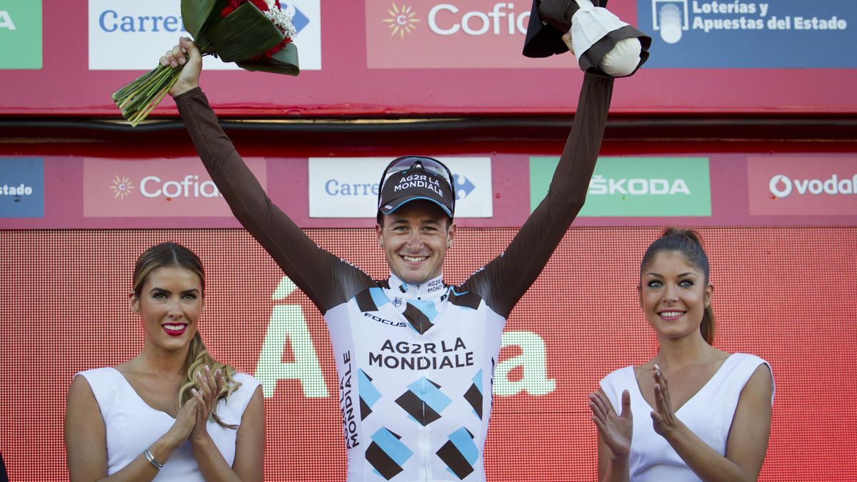 Alexis Gougeard (C) celebrates his victory on the podium
