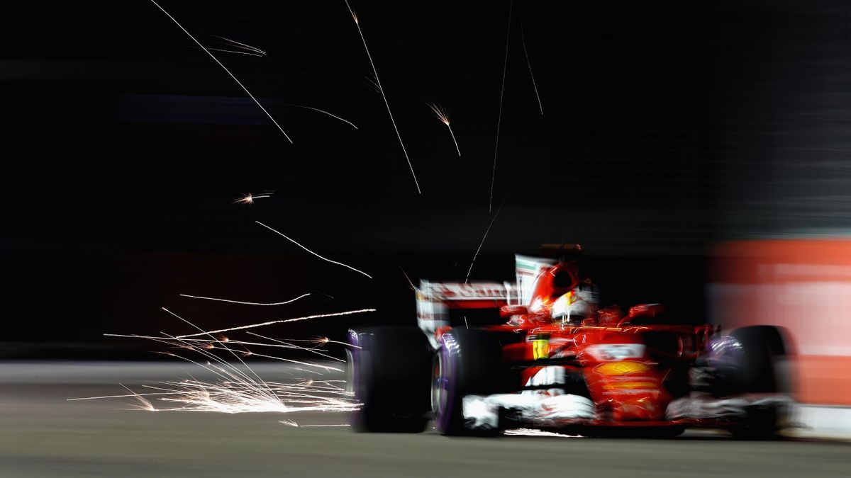 Sparks fly from Sebastian Vettel's Ferrari in qualifying for the Singapore GP