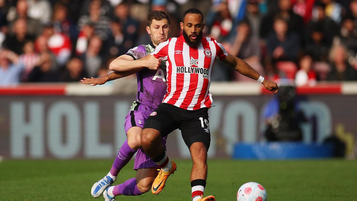 Bryan Mbeumo of Brentford is challenged by Ben Davies of Tottenham Hotspur during the Premier League match between Brentford and Tottenham Hotspur at Brentford Community Stadium on April 23, 2022 in Brentford, England.