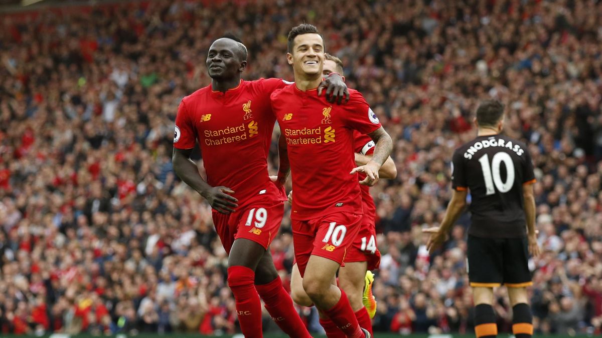 Liverpool's Philippe Coutinho celebrates scoring their fourth goal with Sadio Mane