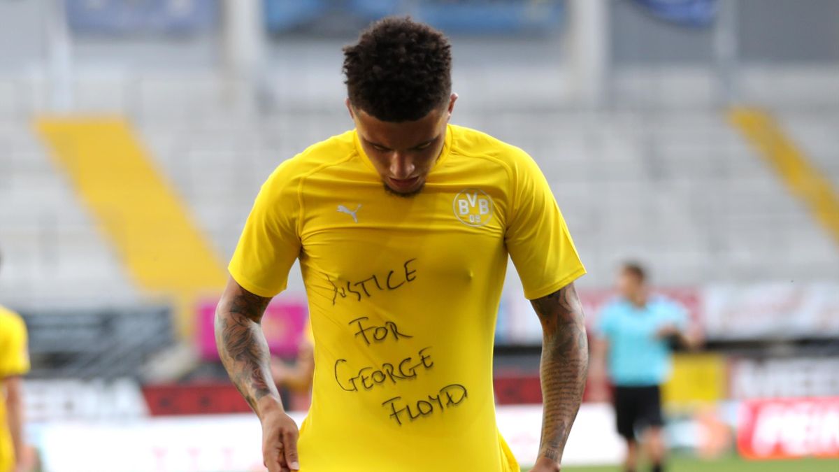 Jadon Sancho of Borussia Dortmund celebrates scoring his teams second goal of the game with a 'Justice for George Floyd'