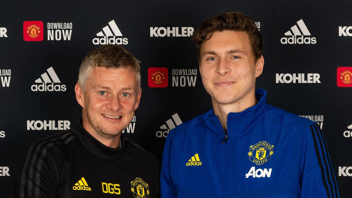Victor Lindelof of Manchester United poses with Manager Ole Gunnar Solskjaer after signing a contract extension at the club at Aon Training Complex on September 18, 2019 in Manchester, England.
