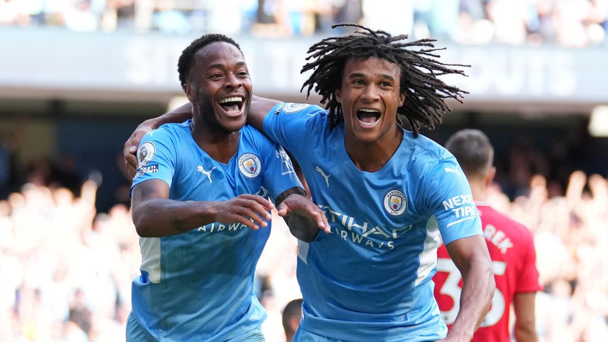 Raheem Sterling of Manchester City celebrates with teammate Nathan Ake after scoring a goal during the Premier League match between Manchester City and Southampton at Etihad Stadium.