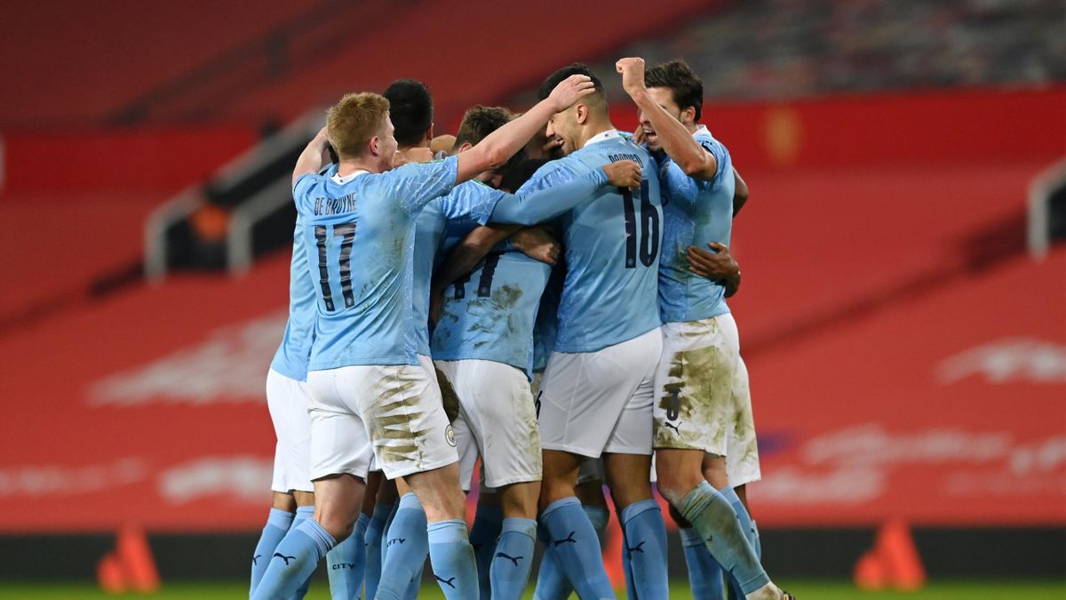 MANCHESTER, ENGLAND - JANUARY 06: Fernandinho of Manchester City celebrates after scoring his teams second goal with his team mates during the Carabao Cup Semi Final match between Manchester United and Manchester City at Old Trafford on January 06, 2021 i
