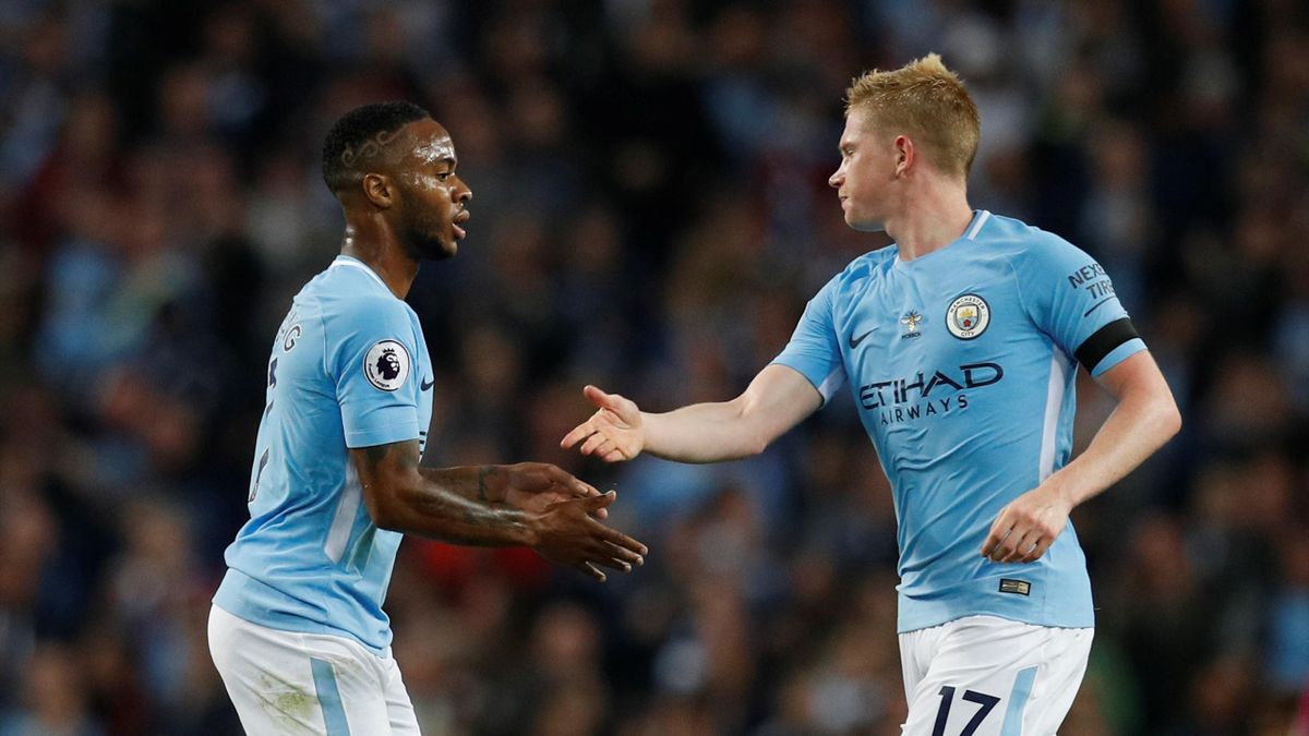 Manchester City's Raheem Sterling celebrates scoring their first goal with Kevin De Bruyne