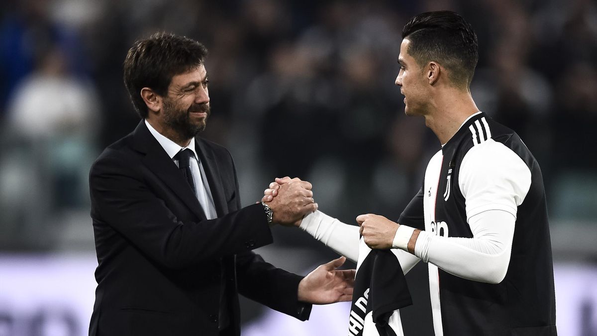 Andrea Agnelli (L) shakes hands with Cristiano Ronaldo of Juventus FC