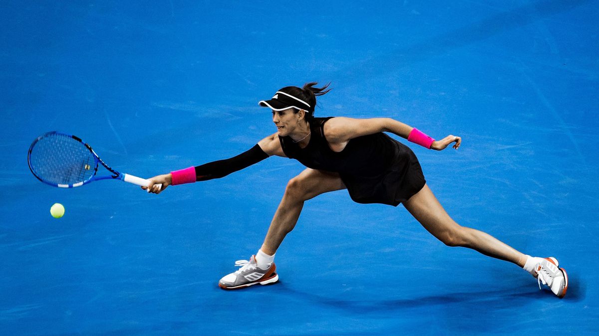 Garbine Muguruza of Spain returns the ball against Aryna Sabalenka of Belarus during her Women's Singles Second Round match of the 2018 China Open at the China National Tennis Centre on October 2, 2018 in Beijing, China.