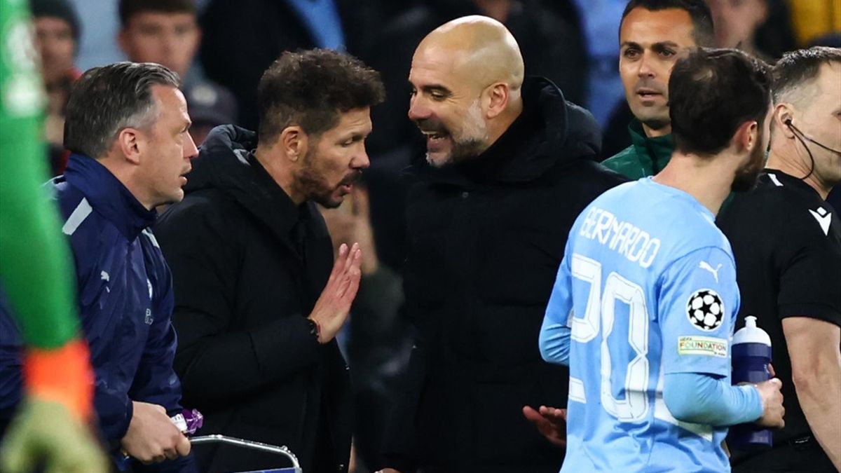Pep Guardiola manager of Manchester City confronts Diego Simeone head coach of Atletico Madrid