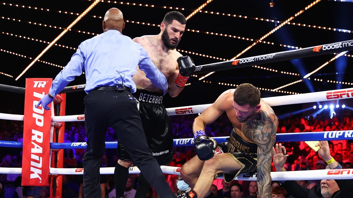NEW YORK, NEW YORK - JUNE 18: Artur Beterbiev (L) knocks-down Joe Smith Jr (R) during their WBC,IBF and WBO light heavyweight Championship fight, at The Hulu Theater at Madison Square Garden on June 18, 2022 in New York City. (Photo by Mikey Williams/Top