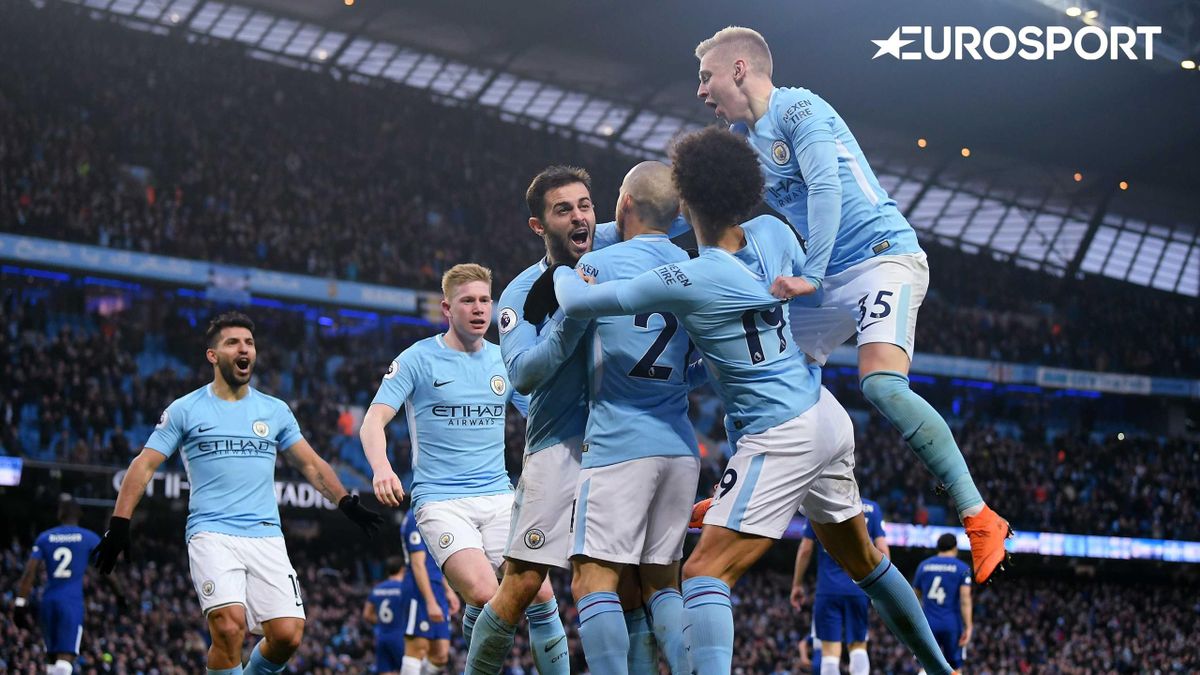Manchester City player celebrate winning the Premier League title