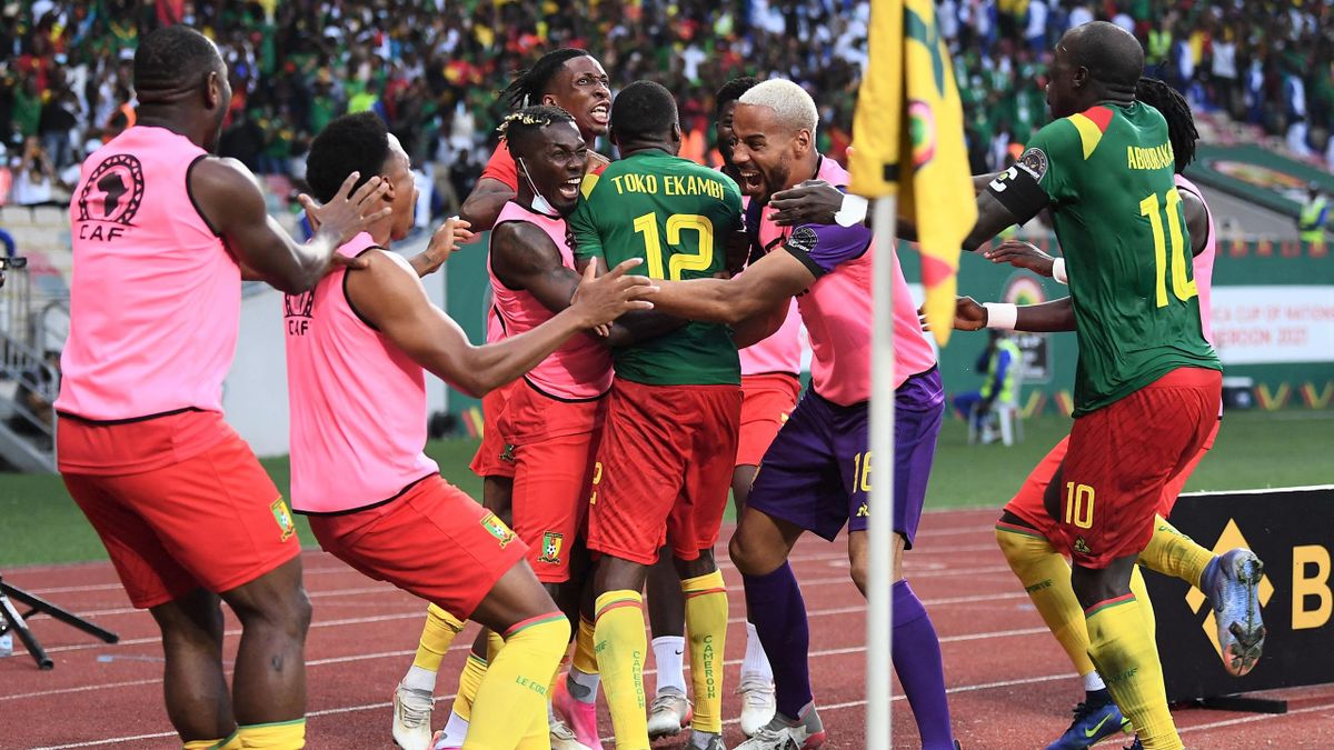 Cameroon forward Karl Toko Ekambi celebrates with team-mates after scoring during the Africa Cup of Nations (CAN) 2021 quarter final football match between Gambia and Cameroon at the Japoma Stadium in Douala on January 29, 2022