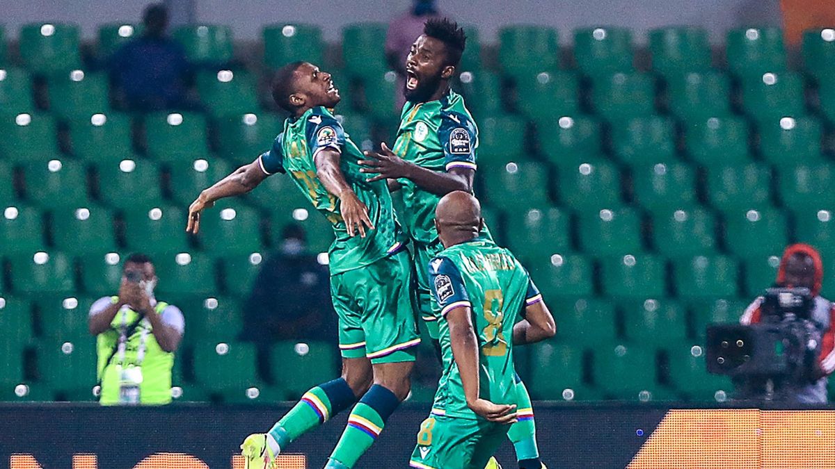 Comoros' players celebrate after scoring the opening goal during the Group C Africa Cup of Nations (CAN) 2021 football match between Ghana and Comoros at Stade Roumde Adjia in Garoua on January 18, 2022