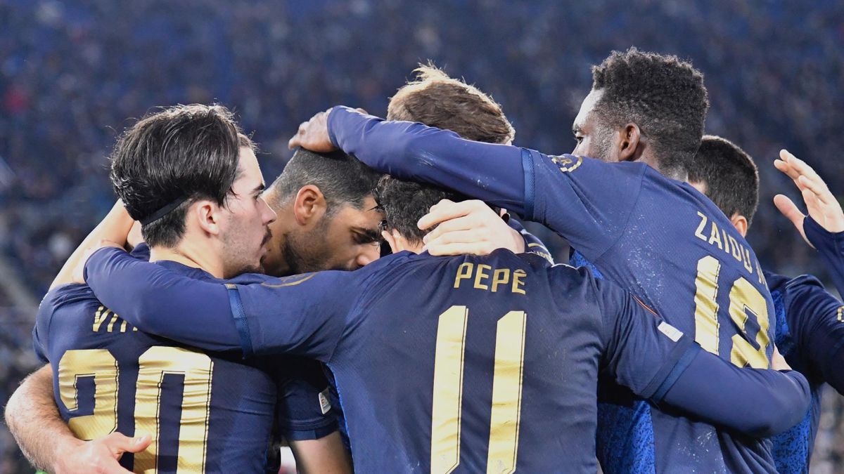 FC Portos Iranian forward Mehdi Taremi (2nd L) celebrates with teammates after scoring a penalty kick during the UEFA Europa League football knockout round play-off second leg match between Lazio and FC Porto at The Olympic Stadium in Rome on February 24,
