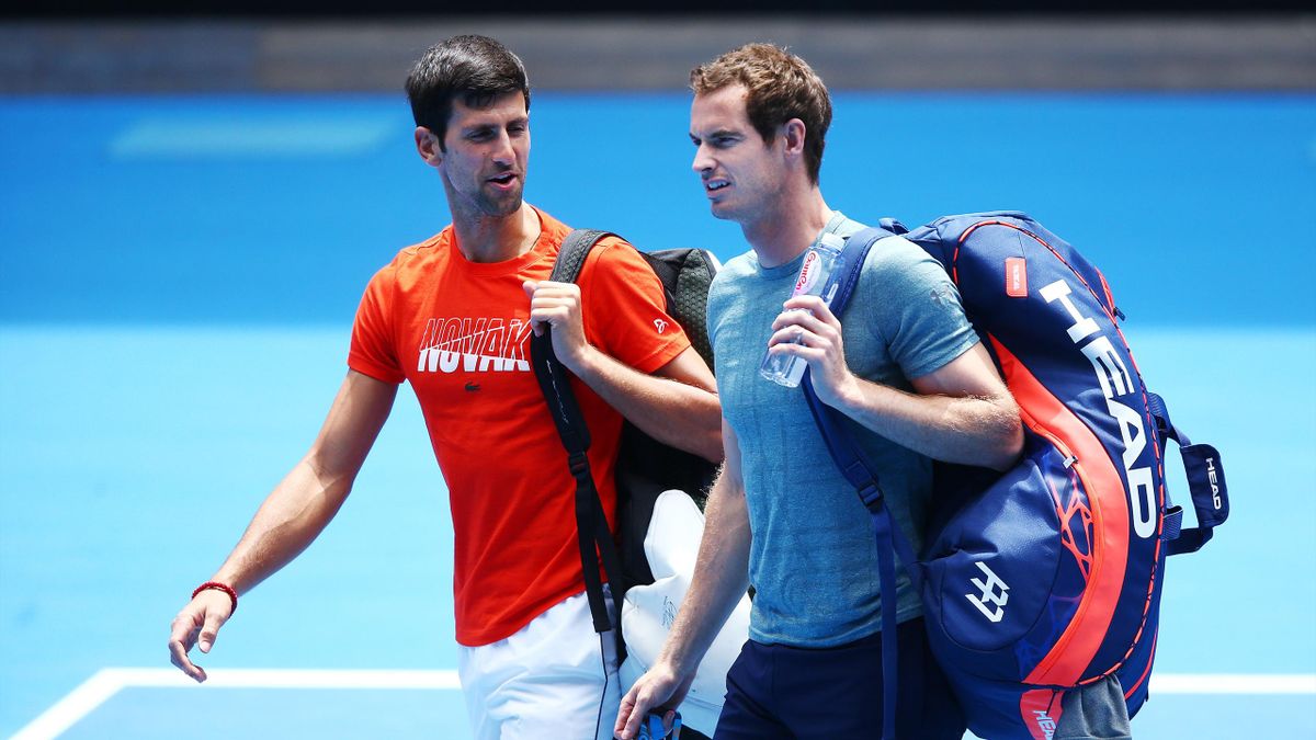 Novak Djokovic of Serbia talks with Andy Murray of Great Britain
