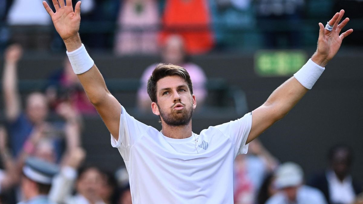 Britain's Cameron Norrie celebrates winning against Belgium's David Goffin at the end of their men's singles quarter final tennis match on the ninth day of the 2022 Wimbledon Championships